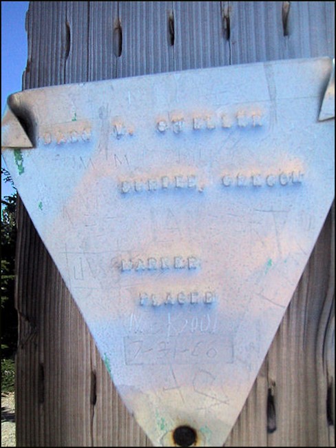 Aluminum marker reads: "Gary T. Steller, Dundee, Oregon, Marker Placed, July 31, 1966."