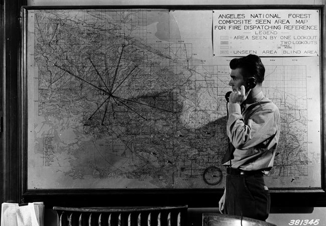 Fire dispatcher’s office, Pasadena, showing fire map and string stretched to indicate azimuth readings from different lookouts on a fire